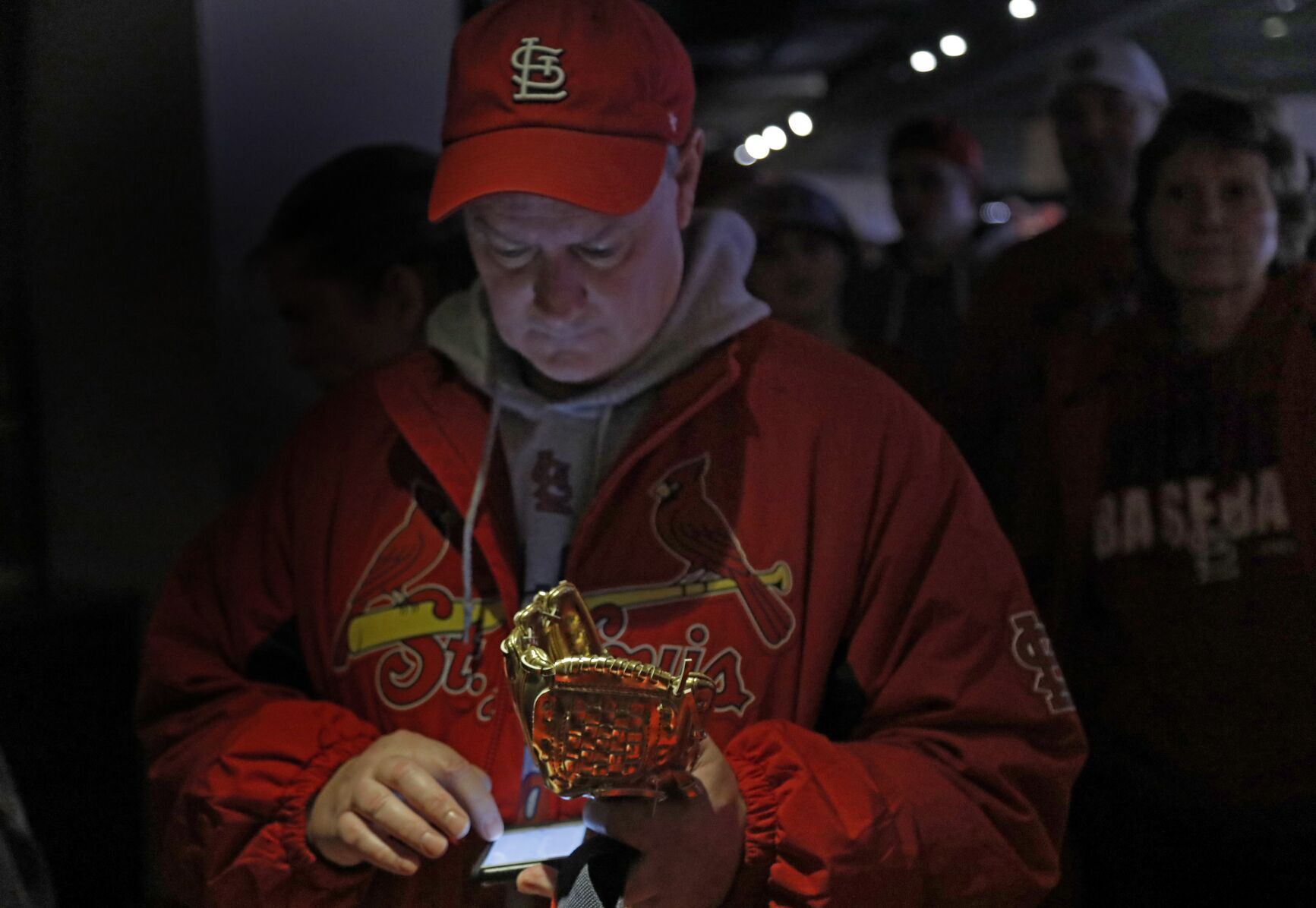 Fan brings golden glove for St. Louis Cardinal left fielder Tyler O'Neill to autograph